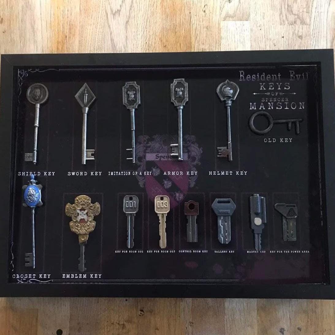 resident evil 1 keys in a shadowbox, replicas of the resident evil 1 game, down to the last detail